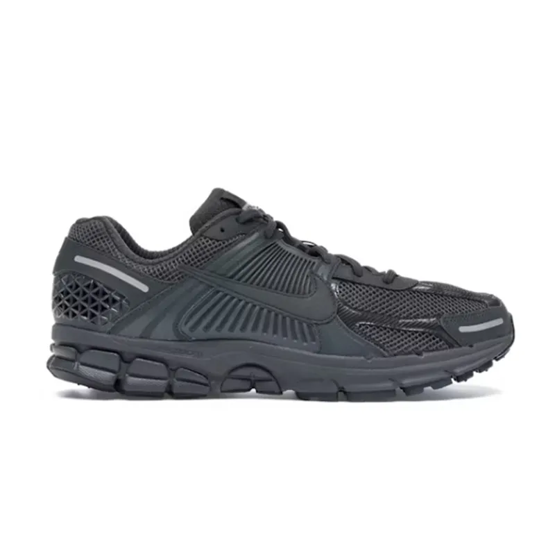 Nike sneakers in black and gray with a chunky low-top runner silhouette.