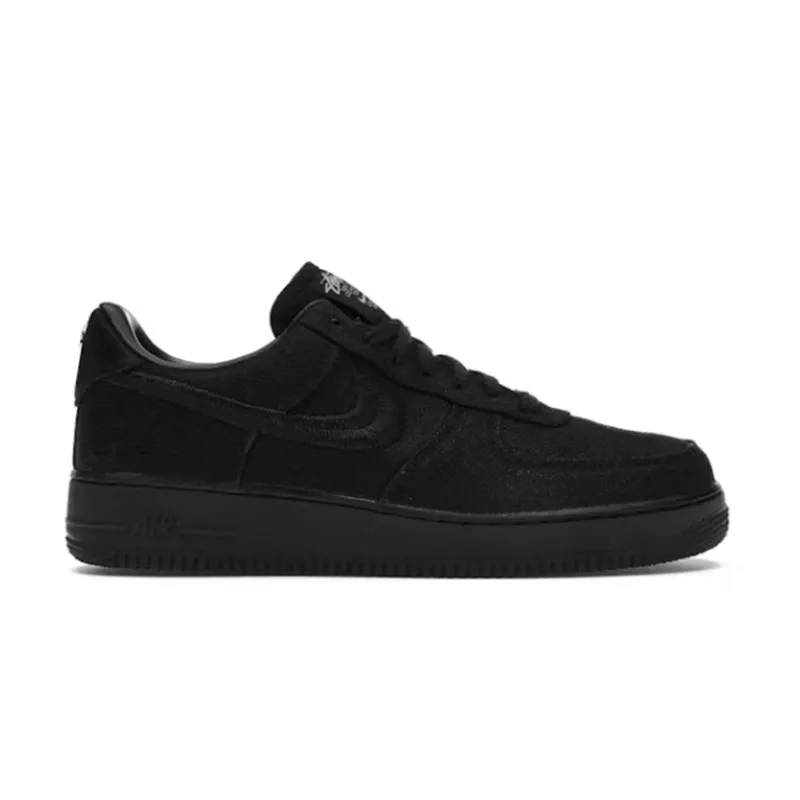 Black Nike low-top sneaker with white side logo and chunky sole.