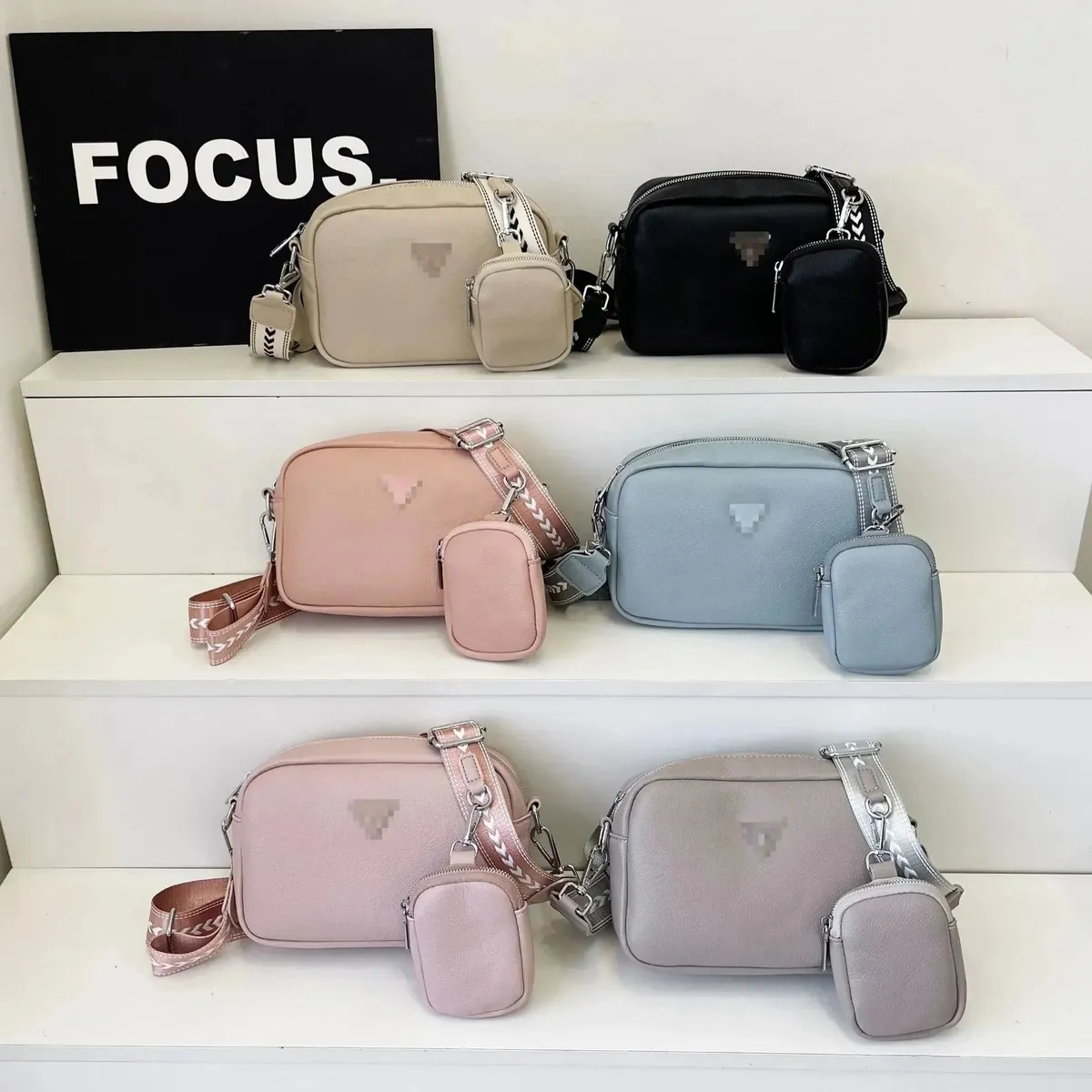 Prada crossbody camera bag with mini pouch shown in multiple colorways