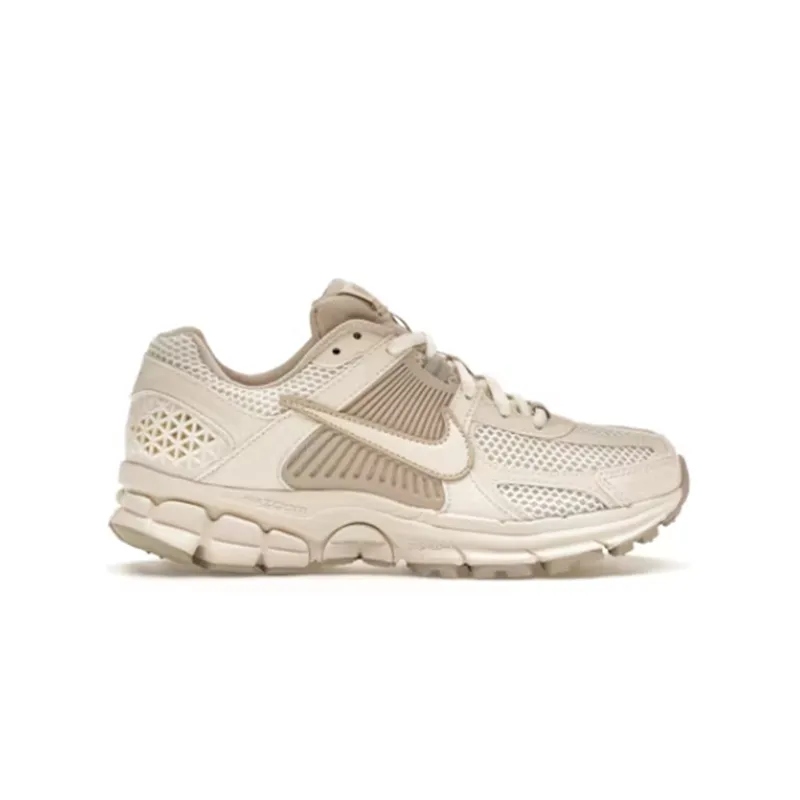 Nike sneaker in brown and sail tones with mesh panels and a chunky sole.