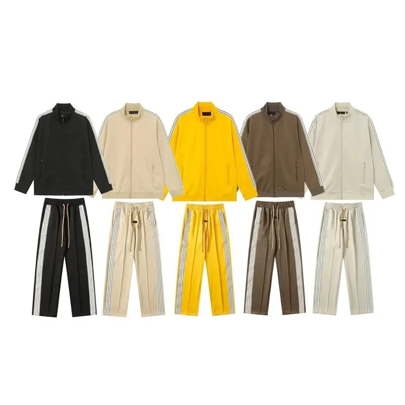 Unbranded clothing set with a zip-up jacket and straight-leg track pants on a white background.
