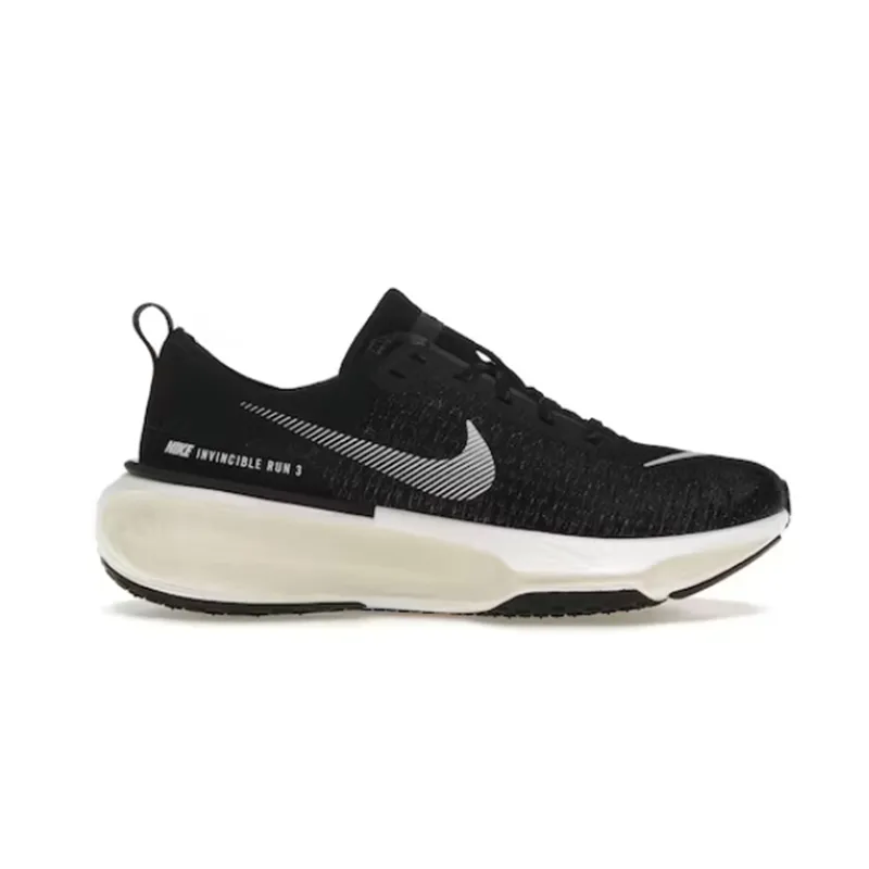 Nike running sneaker in black and white with a chunky cushioned sole and large side swoosh.