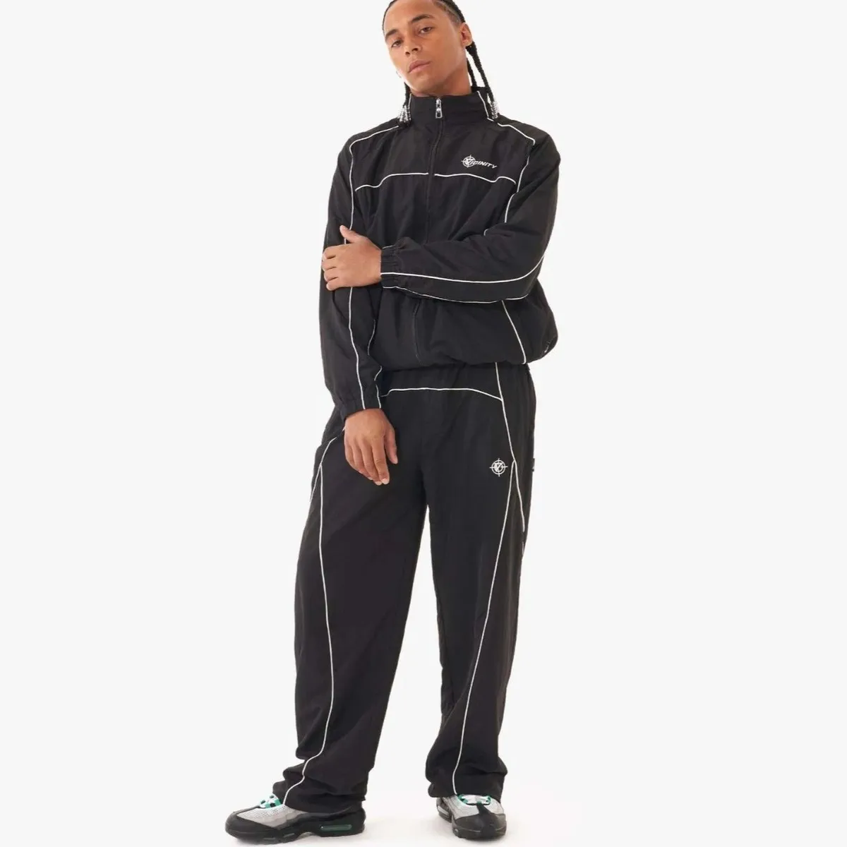 Vicinity black casual jacket and matching pants set with white piping and INFINITY logo.