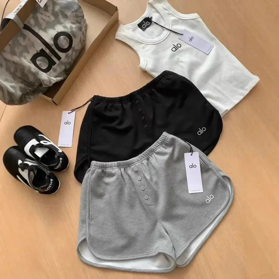 ALO athletic shorts in multiple colorways with an elastic waist and logo trim.