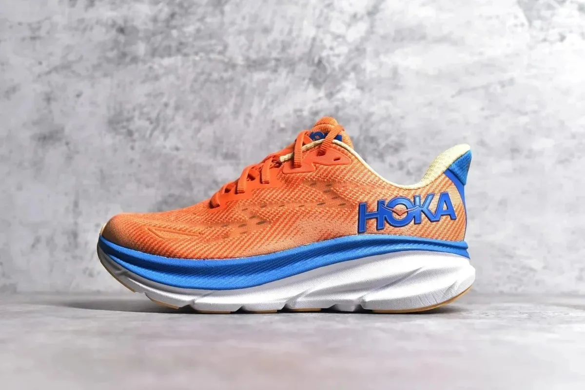 HOKA running shoe in orange, blue, white, and cream with a chunky midsole.