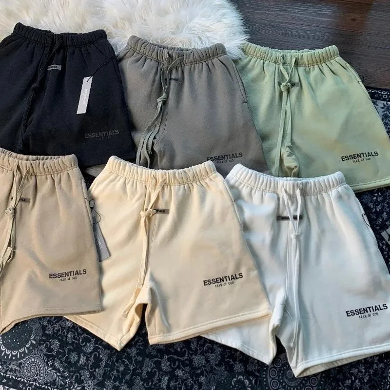 Essentials casual shorts in multiple colors with ESSENTIALS leg print and drawstring waist.