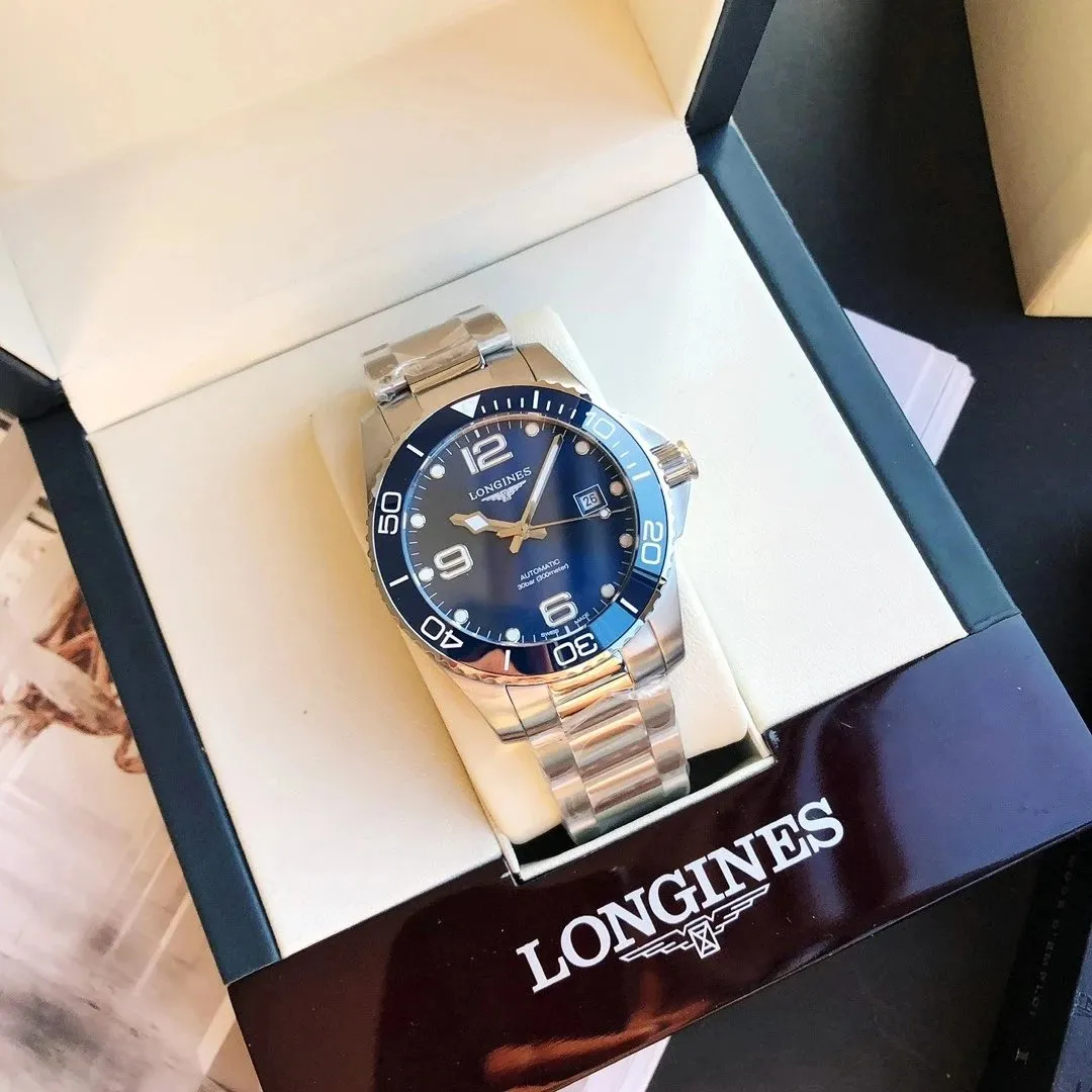 Longines automatic stainless steel watch with a blue dial and metal bracelet in a presentation box.