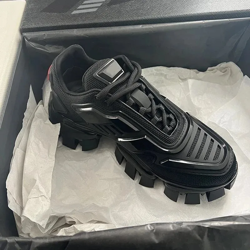Black Prada chunky lace-up sneakers with a lugged sole and silver accents.