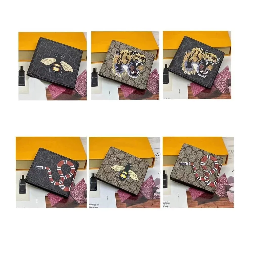 Gucci bi-fold wallet with GG pattern and animal embroidery in a slim dark-brown design.