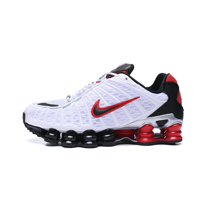 Gucci athletic sneaker in white, red, and black with a chunky low-top sole.