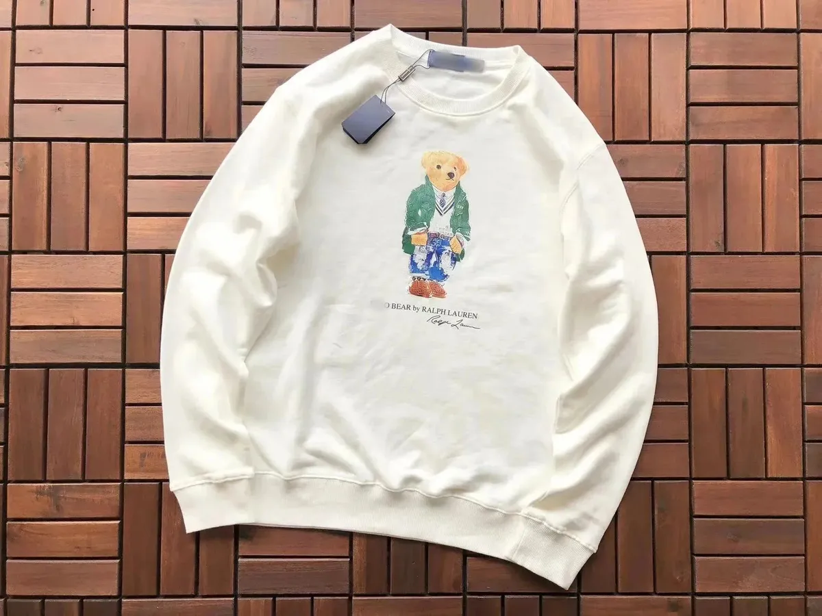 White Ralph Lauren sweatshirt with a Polo Bear front graphic and ribbed crewneck trim.
