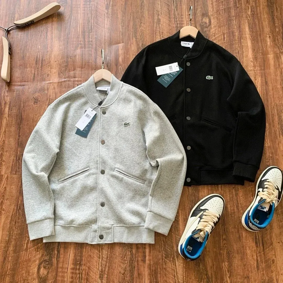Lacoste men's button-up bomber jacket in a relaxed fit with ribbed trim and snap front.