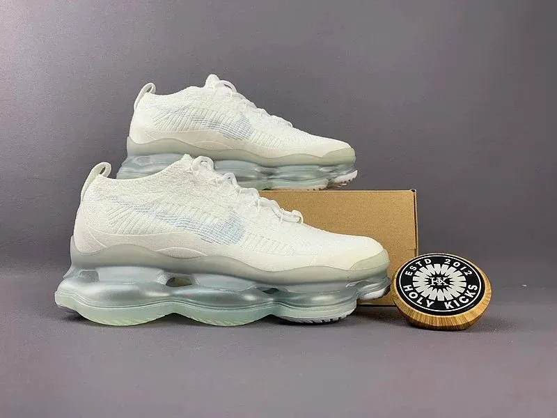 Nike white high-top sneakers with a knit upper and translucent bubble sole.