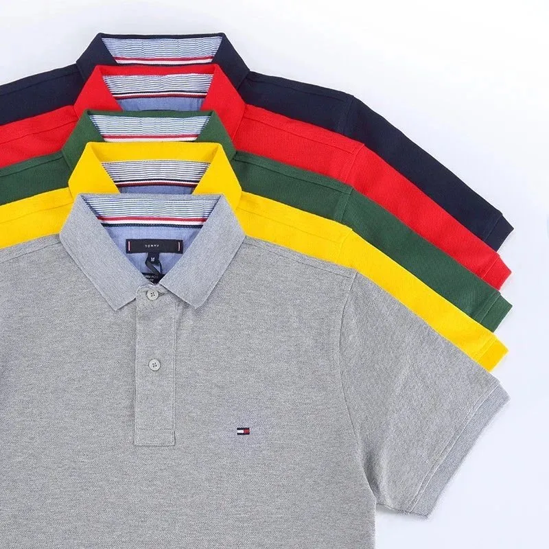 Tommy Hilfiger short sleeve polo shirt in gray with a striped collar and chest logo.