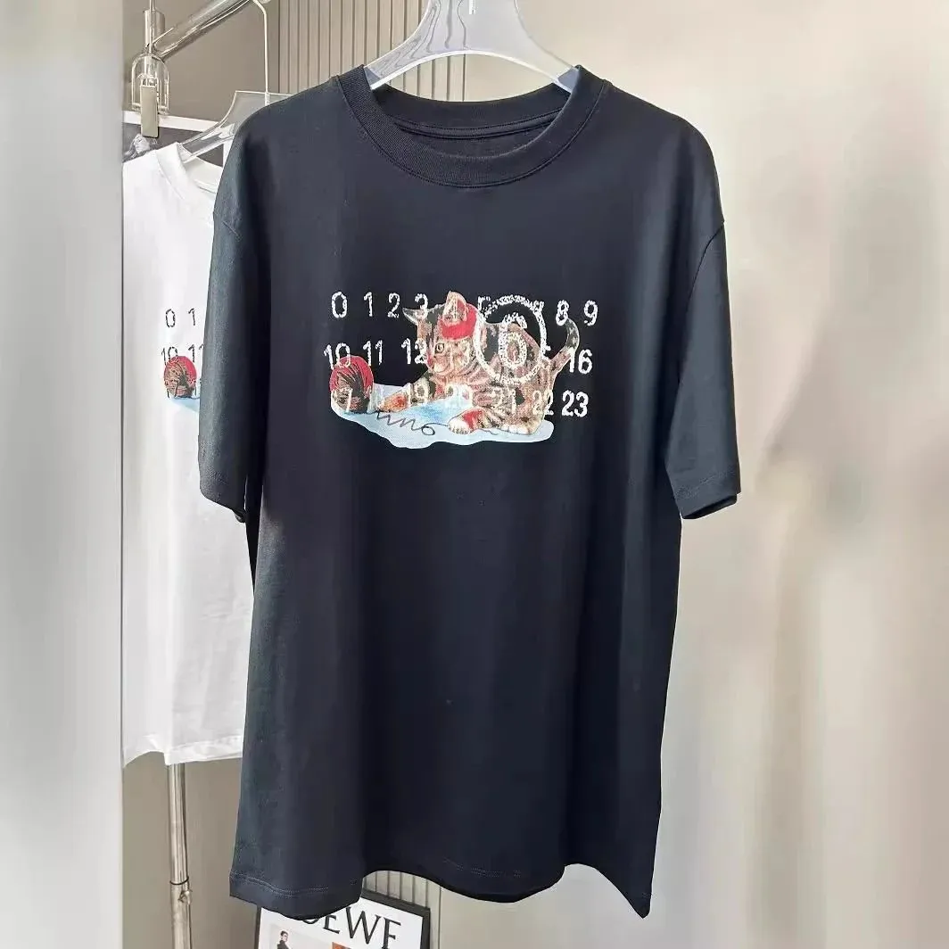 Black Maison Margiela T-shirt with a large front graphic print and crew neck.