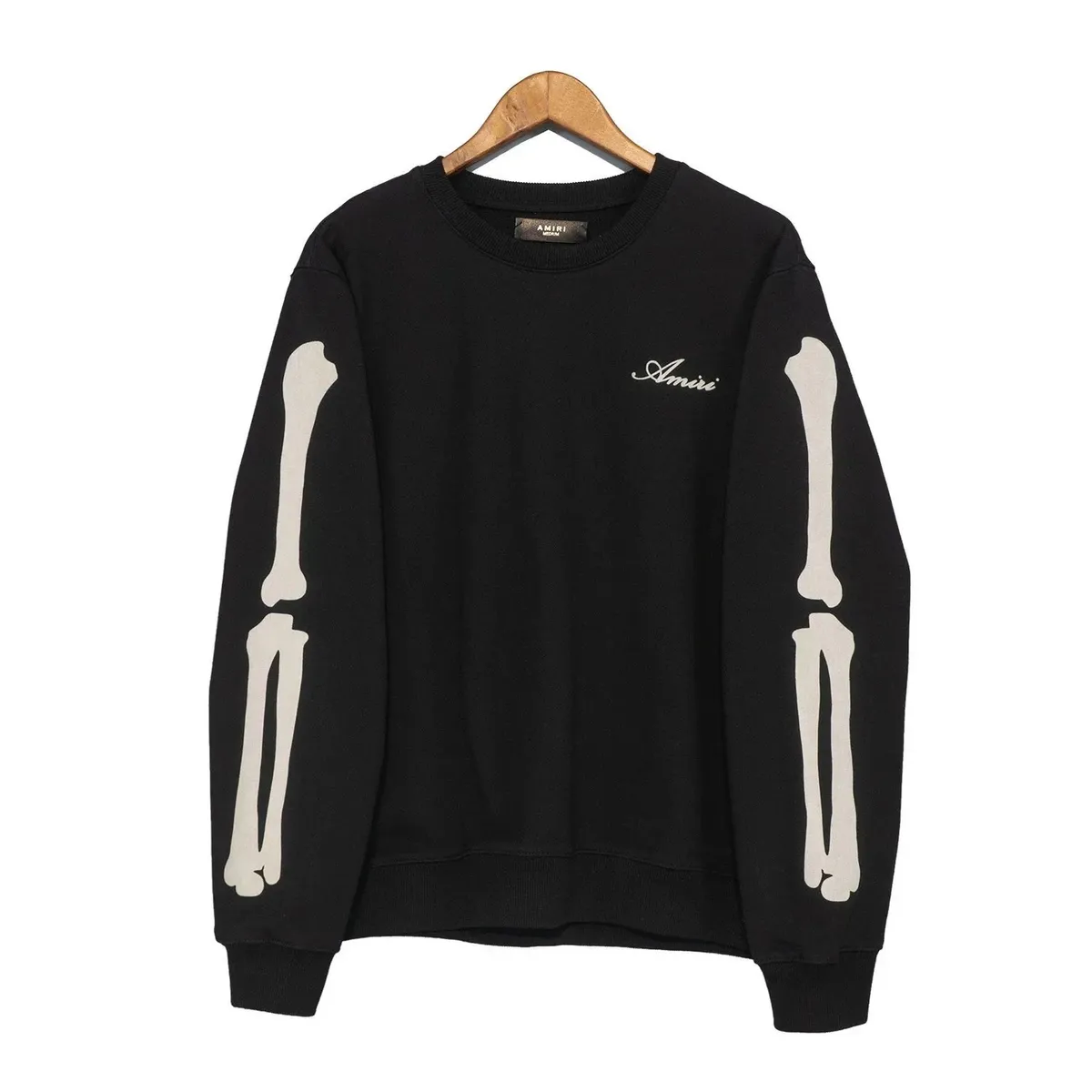 Black AMIRI crewneck sweatshirt with white bone graphics on the sleeves and a small chest script.