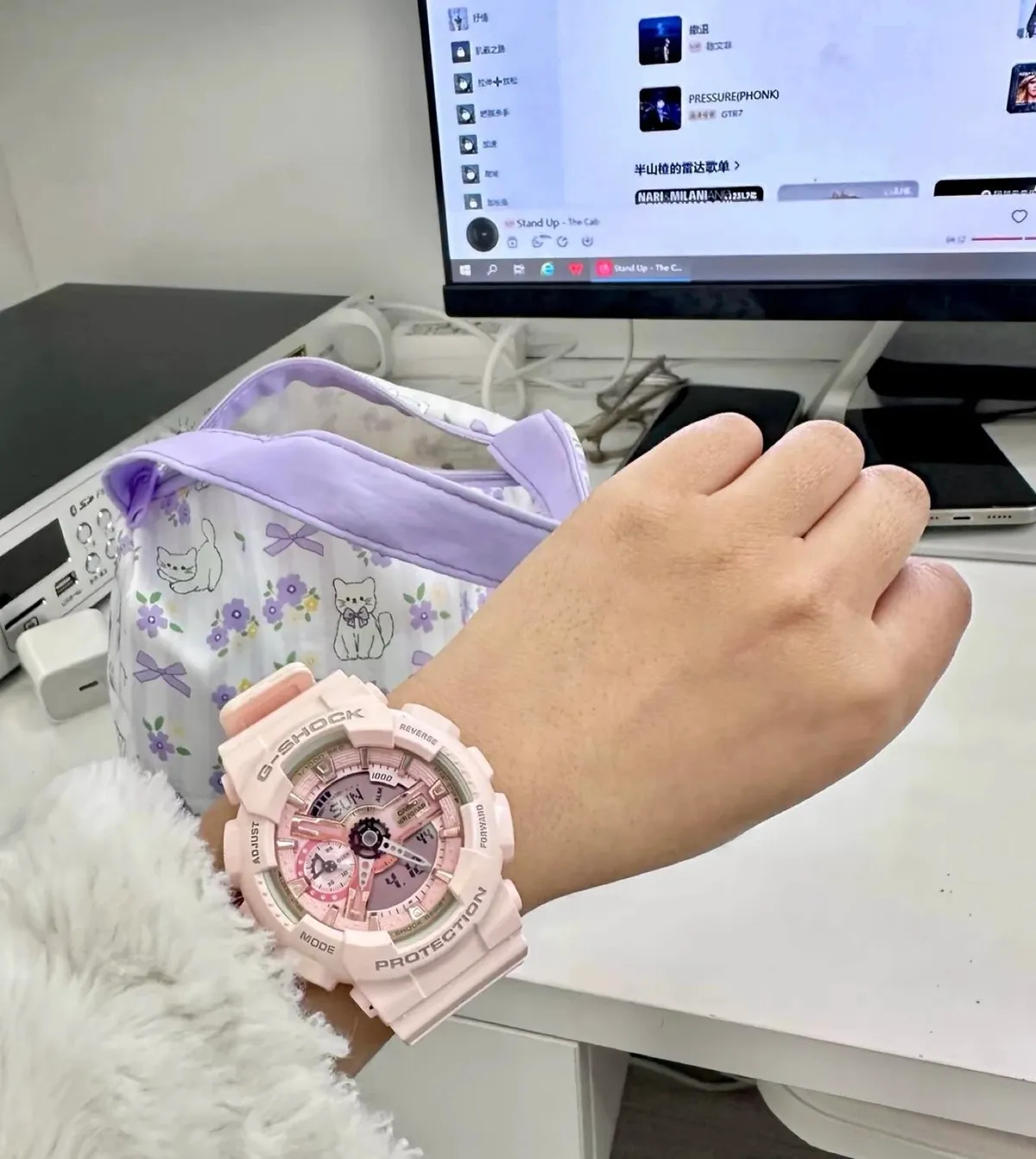 Pink Casio G-Shock analog-digital watch with a large round case and thick strap.