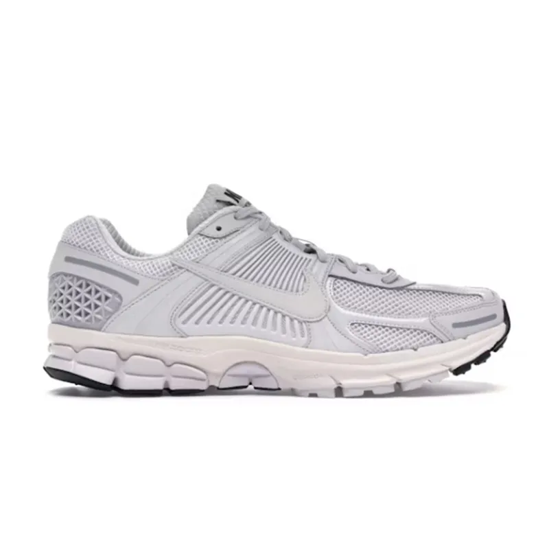Nike grey low-top running sneakers with mesh panels and a chunky sole