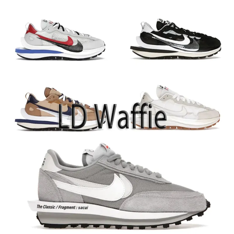 Nike sneakers niski profil w warstwowej, szaro-biało-czarnej kolorystyce na zdjęciu produktowym.