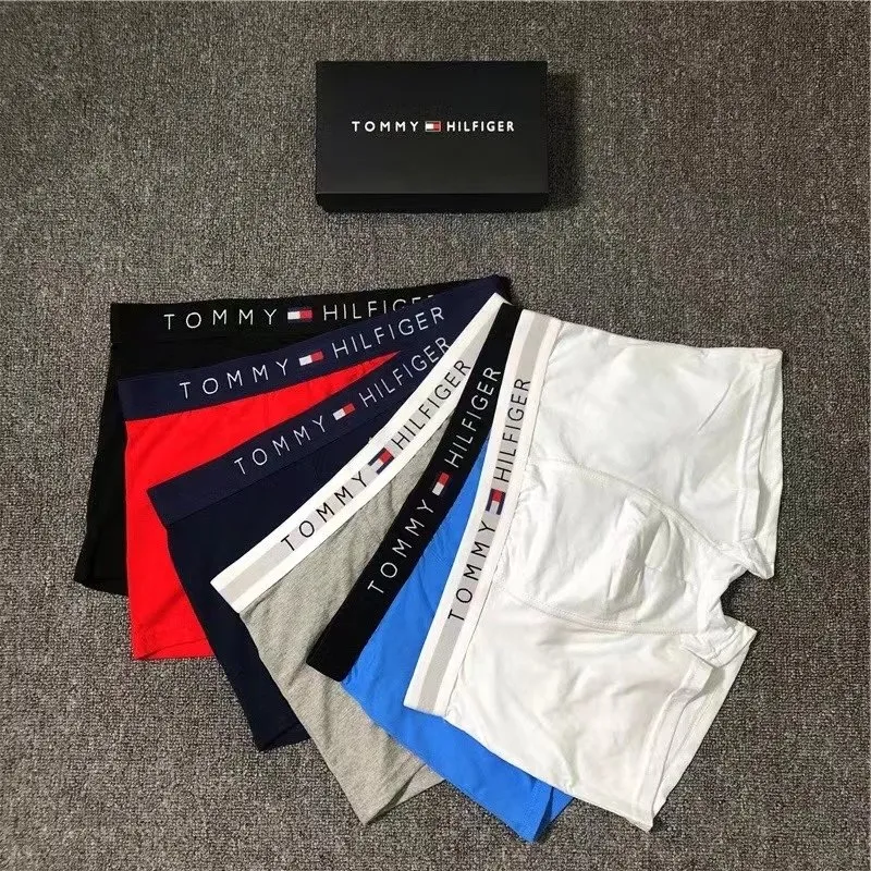 Tommy Hilfiger boxer briefs laid out with a branded waistband and mixed colors.