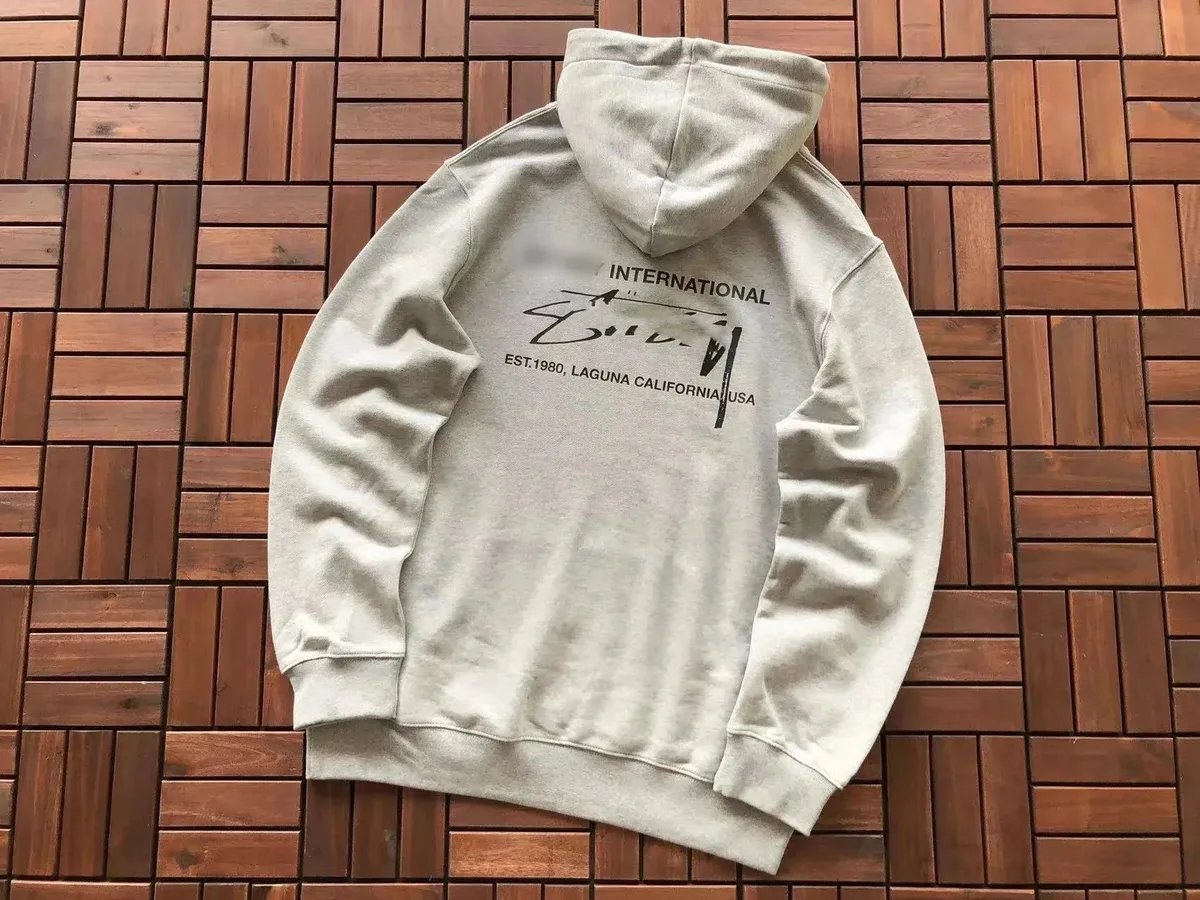 Light gray Cactus Jack hoodie with a bold black front graphic and relaxed fit.