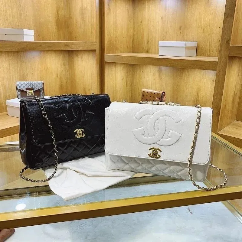Chanel quilted chain shoulder bag with gold logo hardware and a structured flap design.