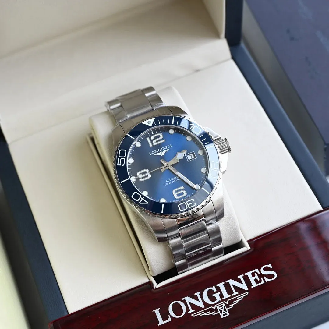 Longines automatic watch with blue dial and stainless steel bracelet in a presentation box.